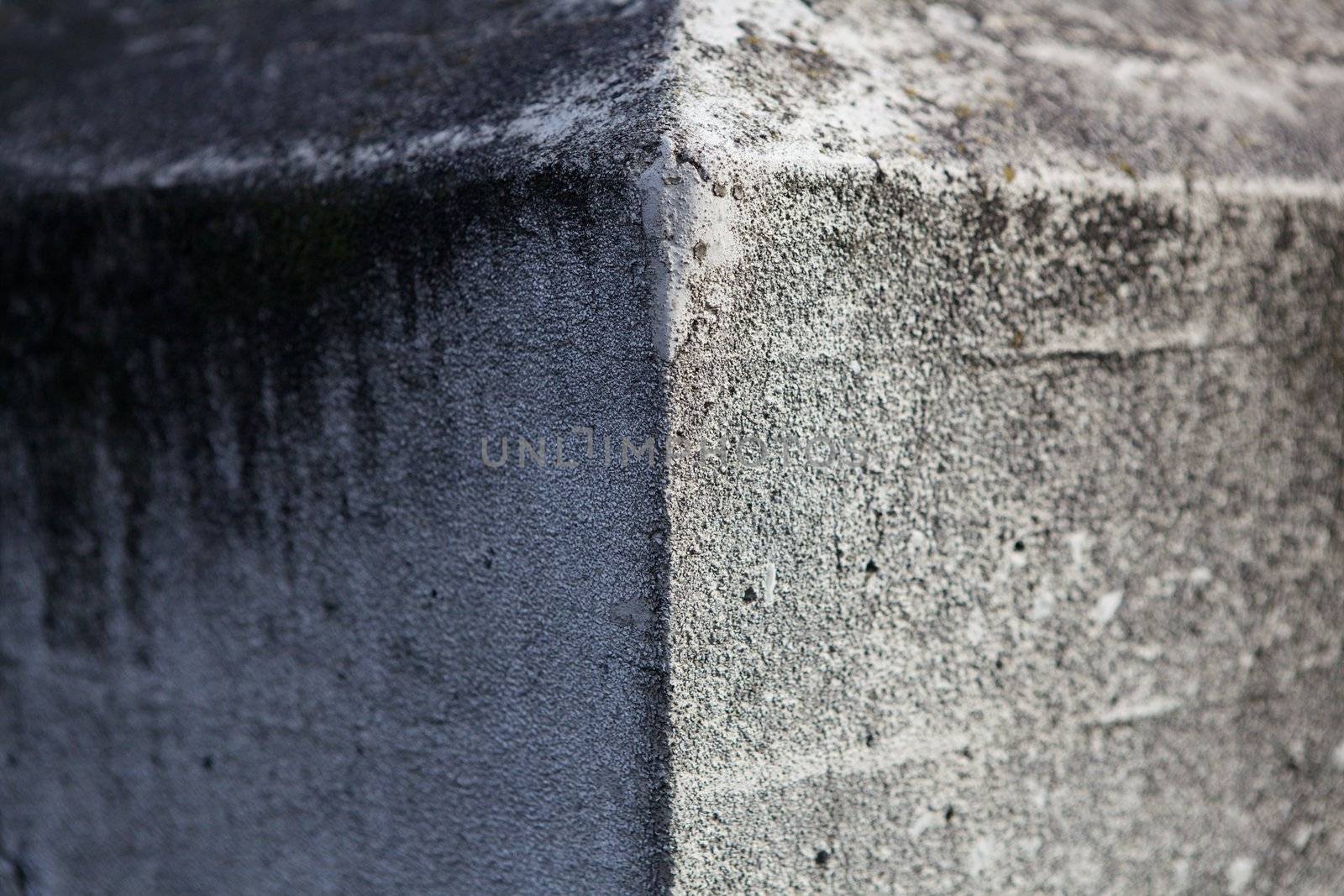 Pointed corner of a concrete wall that diminishes to soft focus