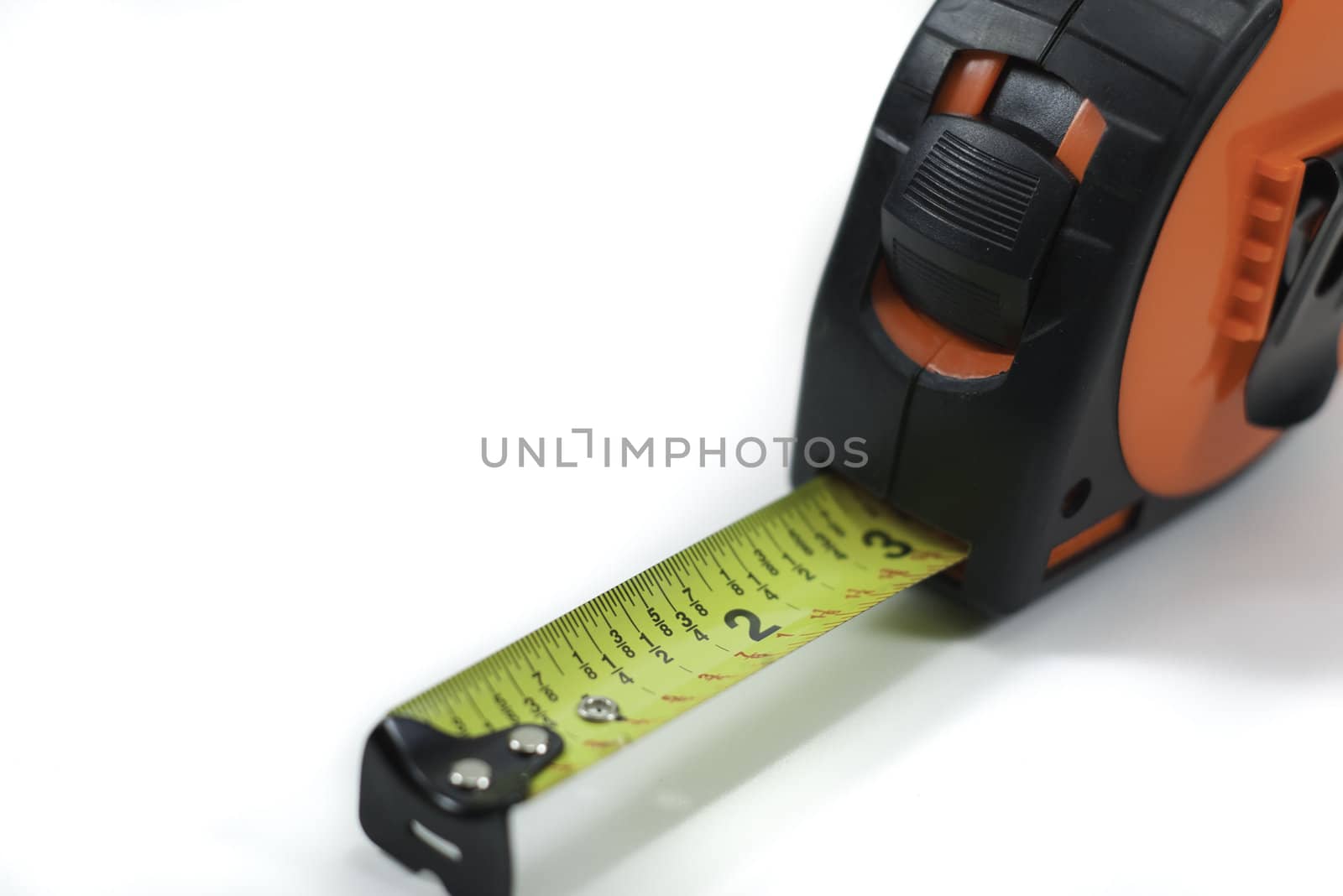 extended orange tape measure isolated on white background