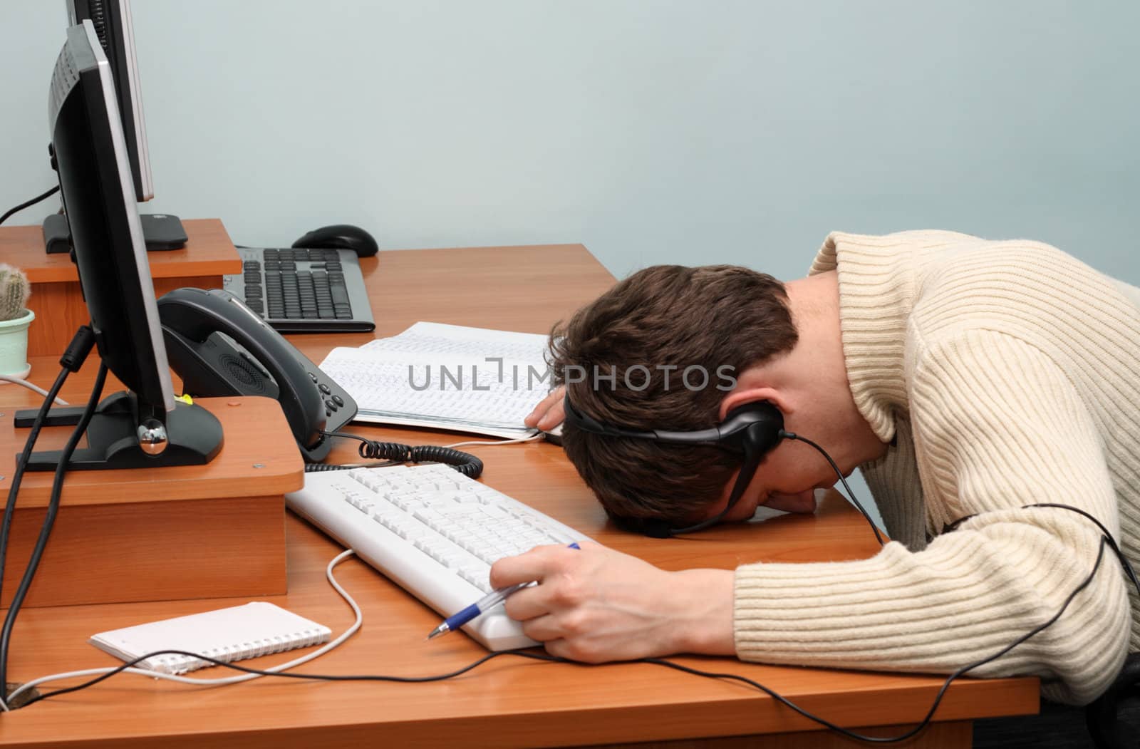 Overstrained office worker, sleeping on the keyboard