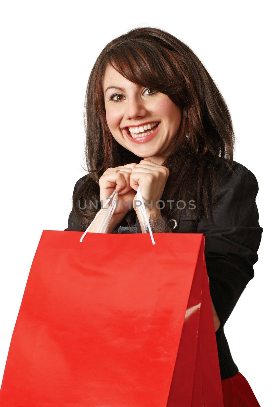 An crazy happy shopping girl holding bags and filled with glee.
