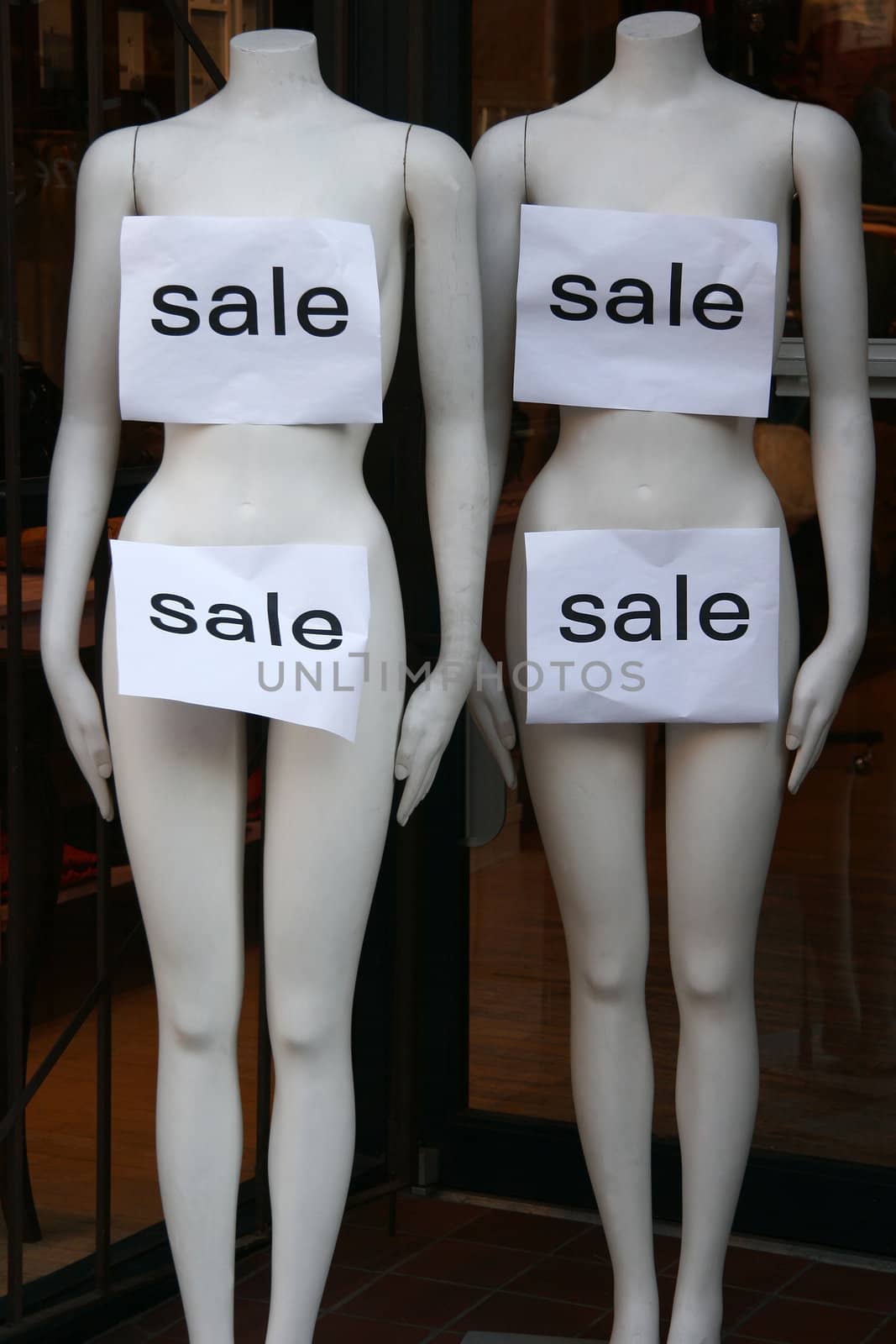 Sale signs on mannequins