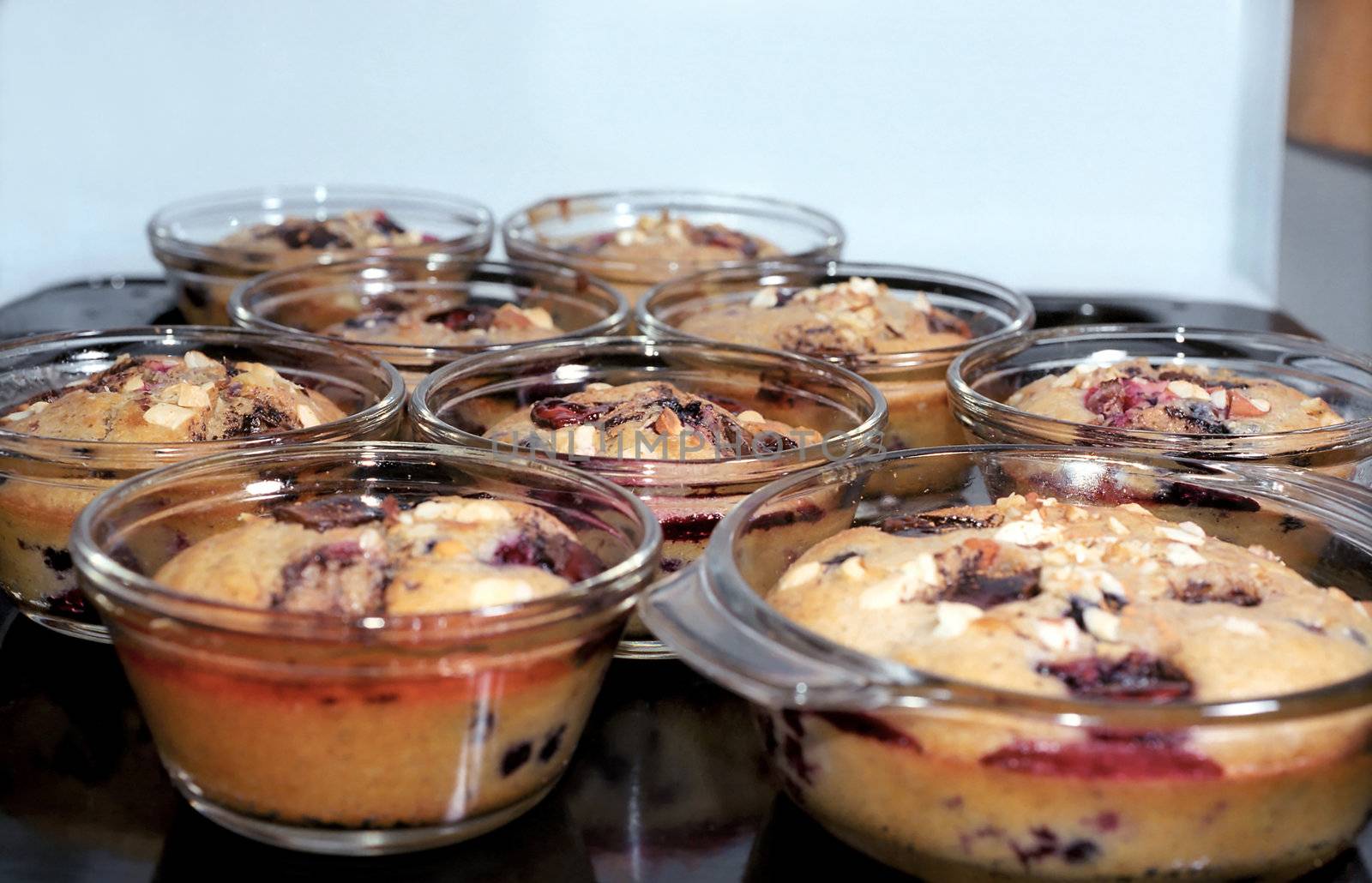 Muffins cakes in glass pans on the cookie sheet