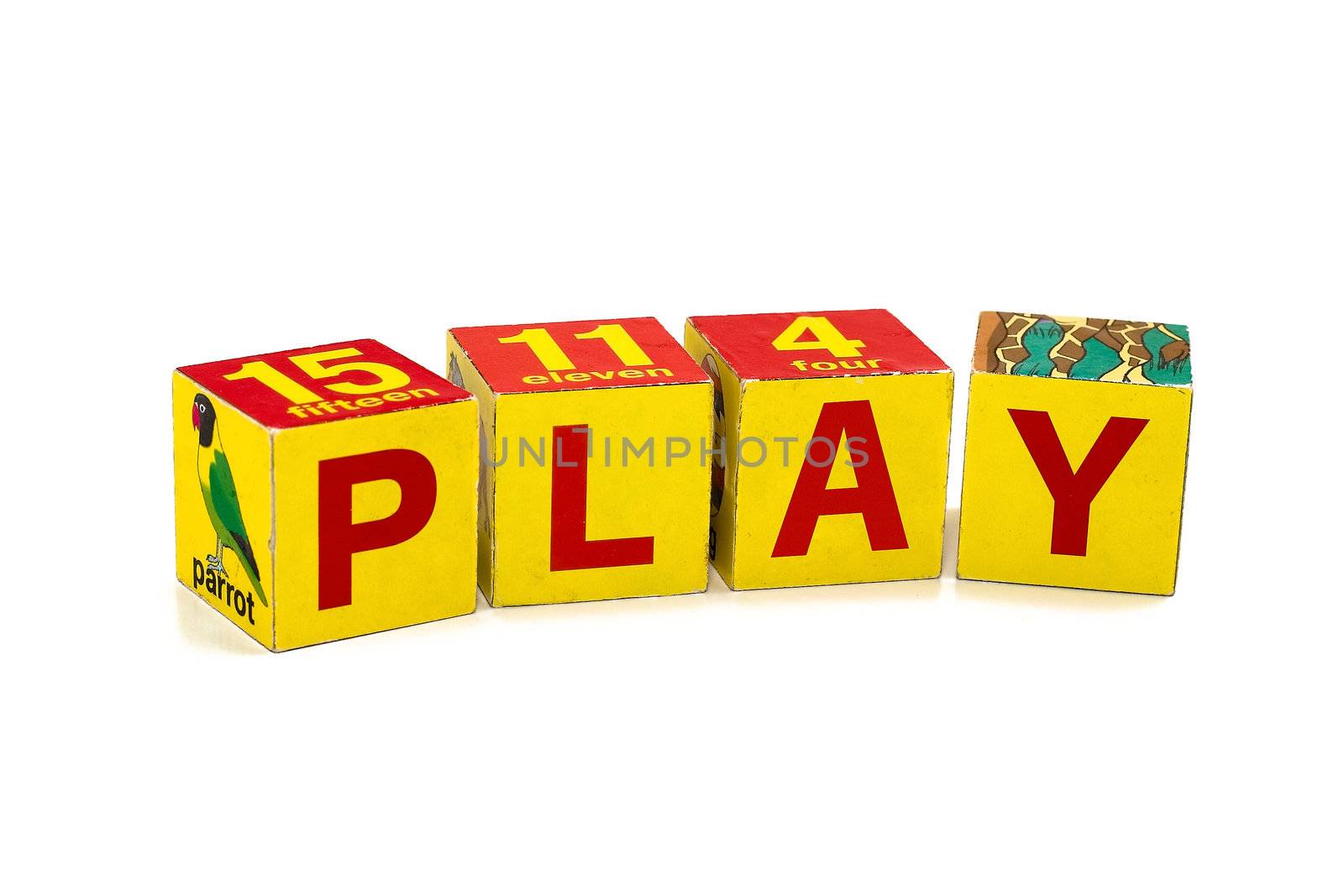 Word "PLAY" made of children's cubes. Studio shooting.