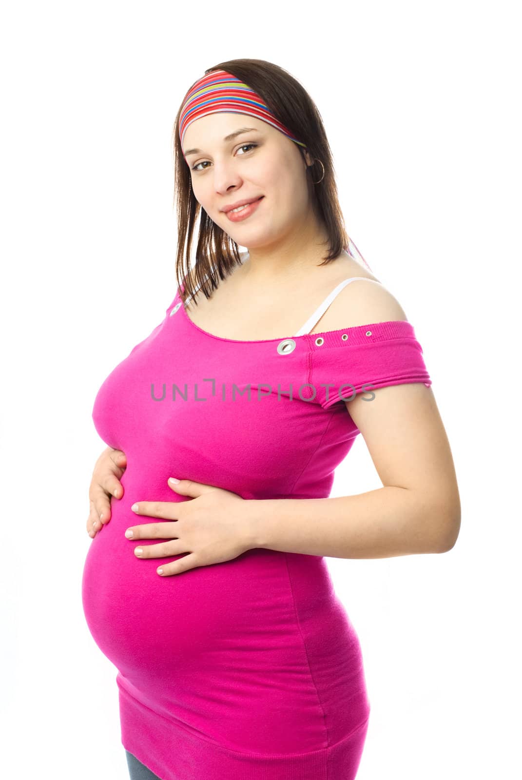 portrait of a beautiful young pregnant woman against white background