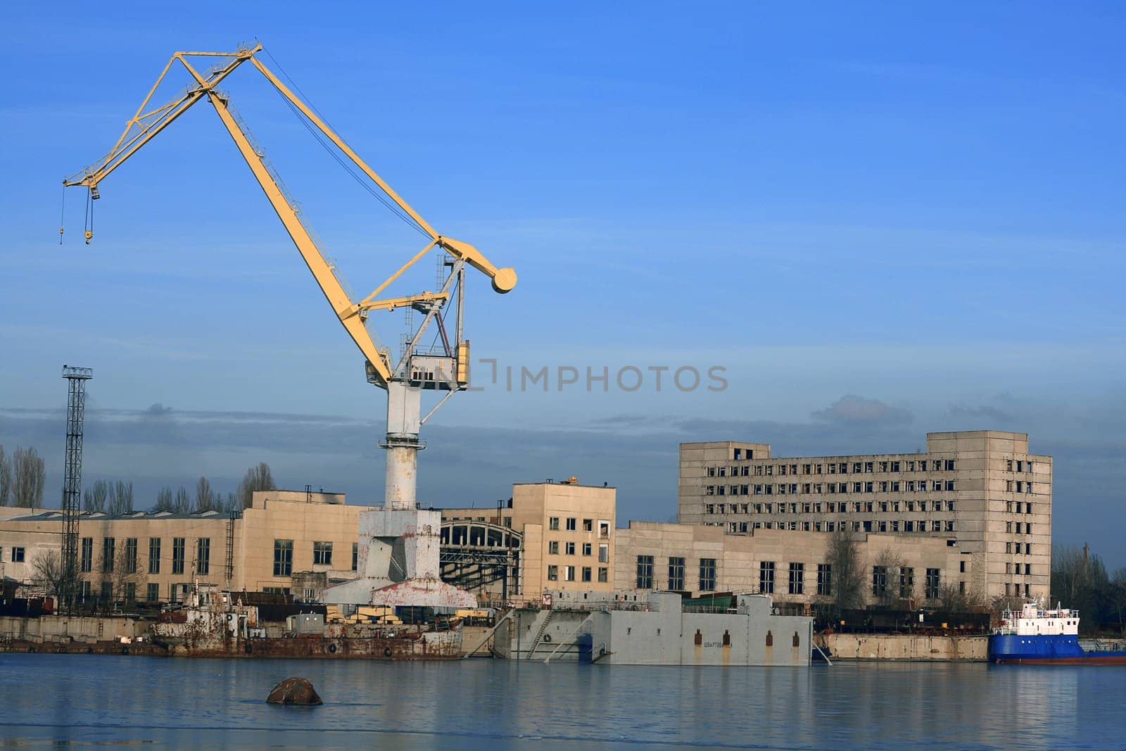 Industrial crane in a shipbuilding plant by Gdolgikh