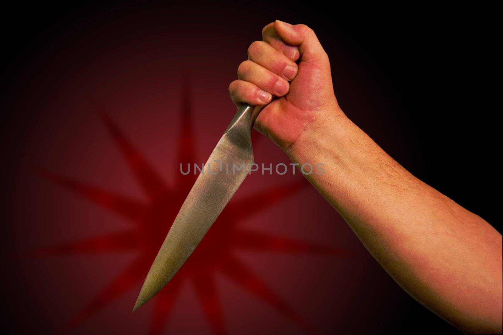 A hand holds a knife ready to stab. With clipping path so you can easily remove from background,