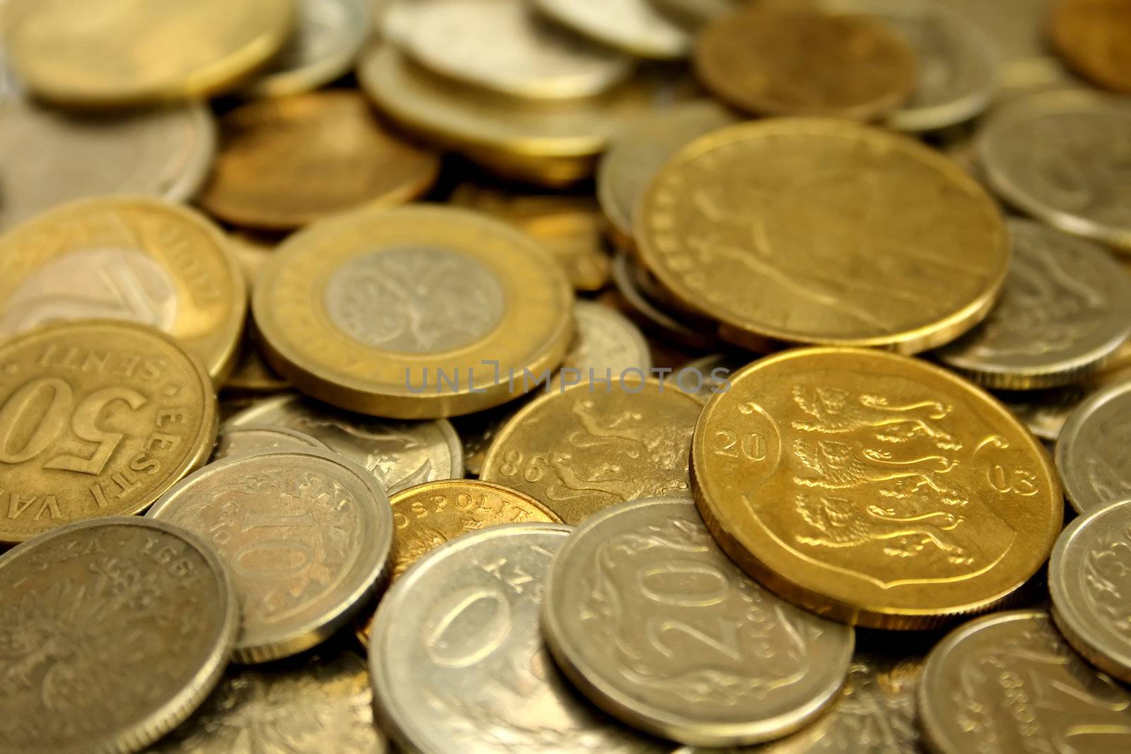 A pile of coins close-up by Gdolgikh