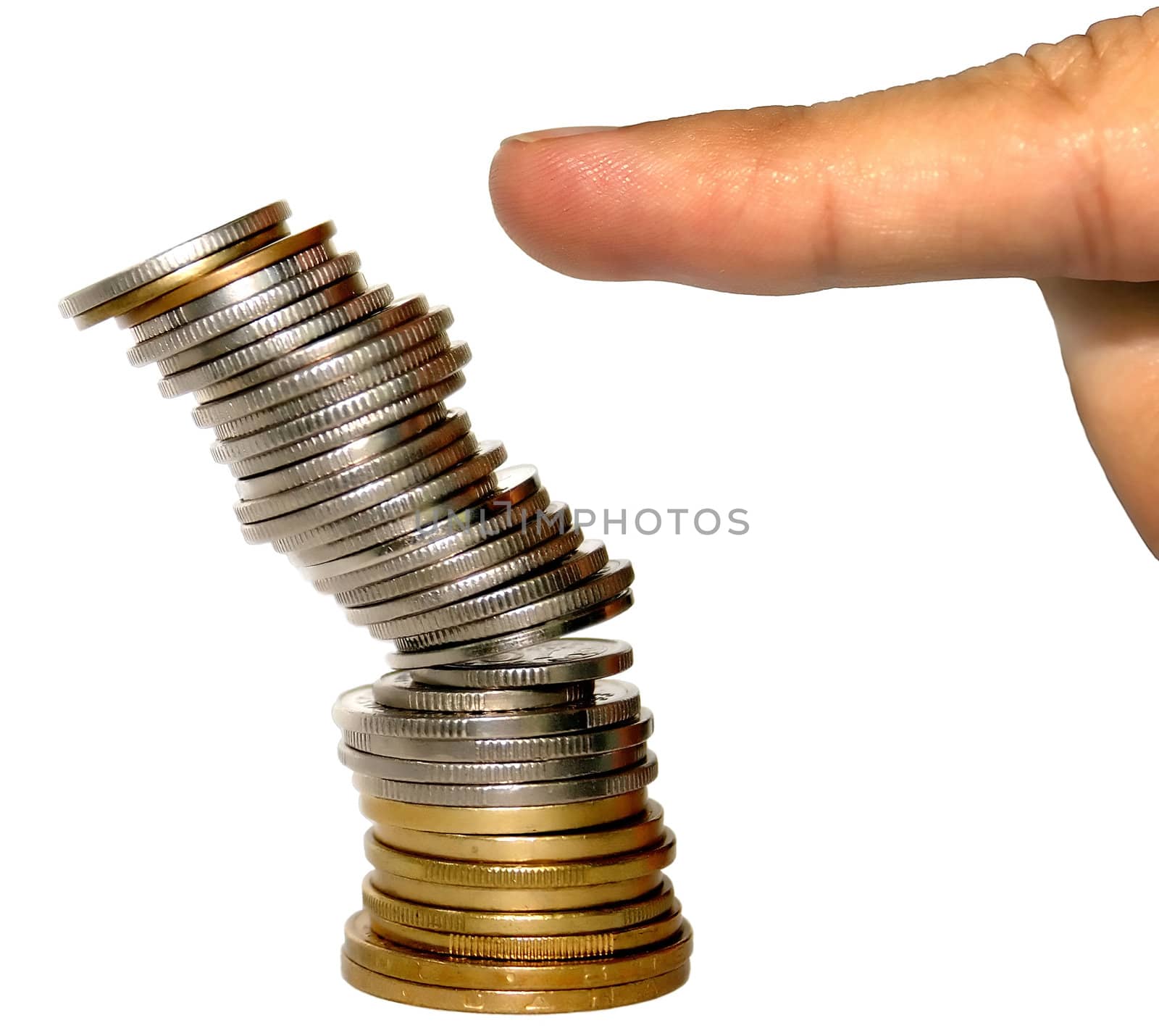 A pile of coins falling pushed by a finger.