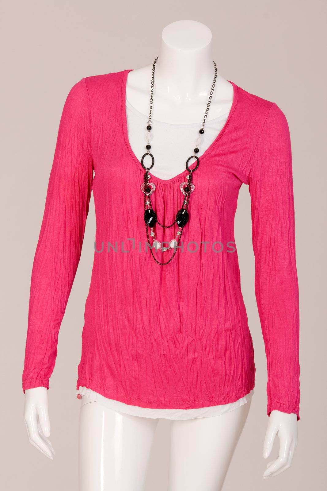 Mannequin dressed in a Pink shirt and fashionable chain