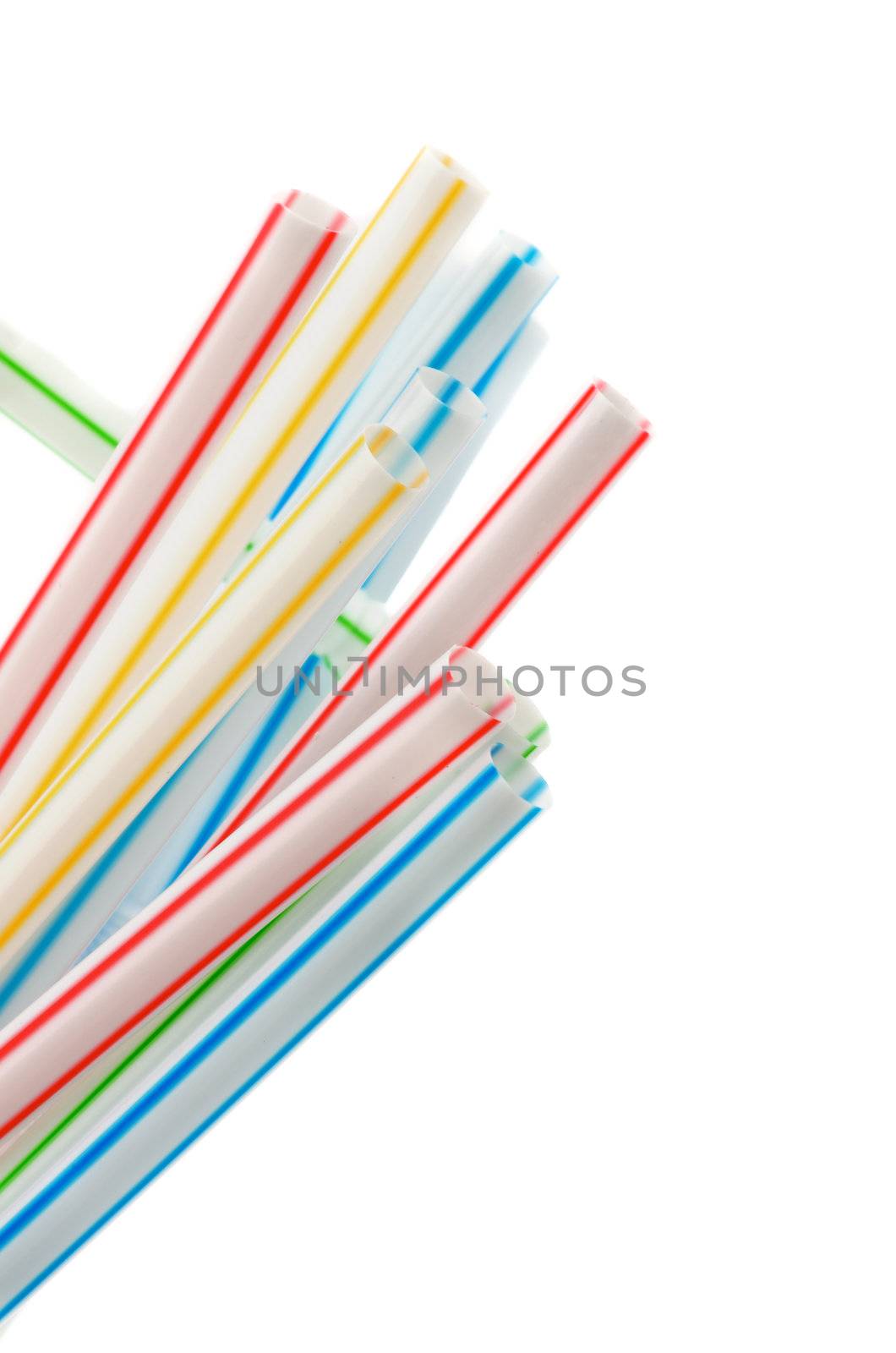Heap of Striped Drinking Straws closeup on white background