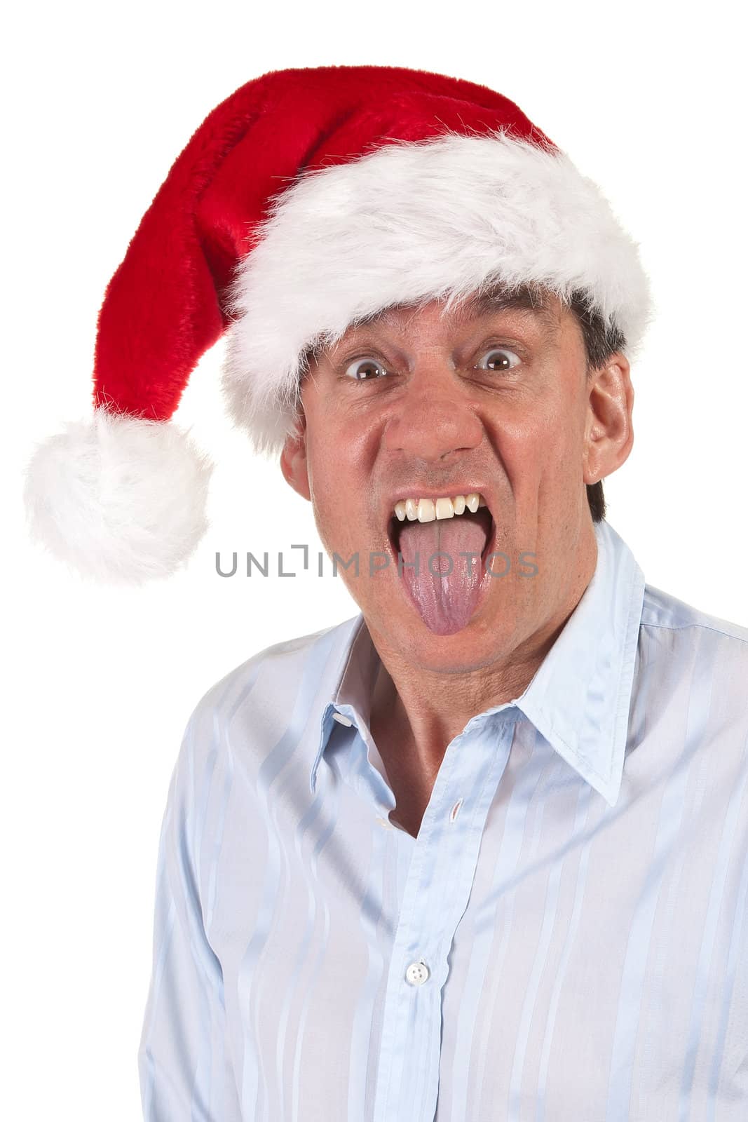 Headshot Portrait of Middle Age Business Man in Christmas Santa Hat Sticking Out Tongue Isolated