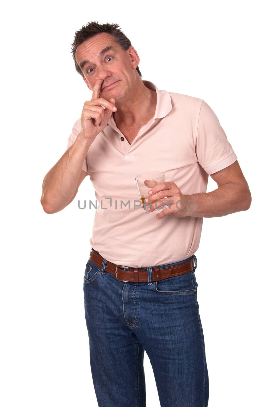 Surprised Middle Age Man Caught Picking Nose with Finger and Drinking Alcohol