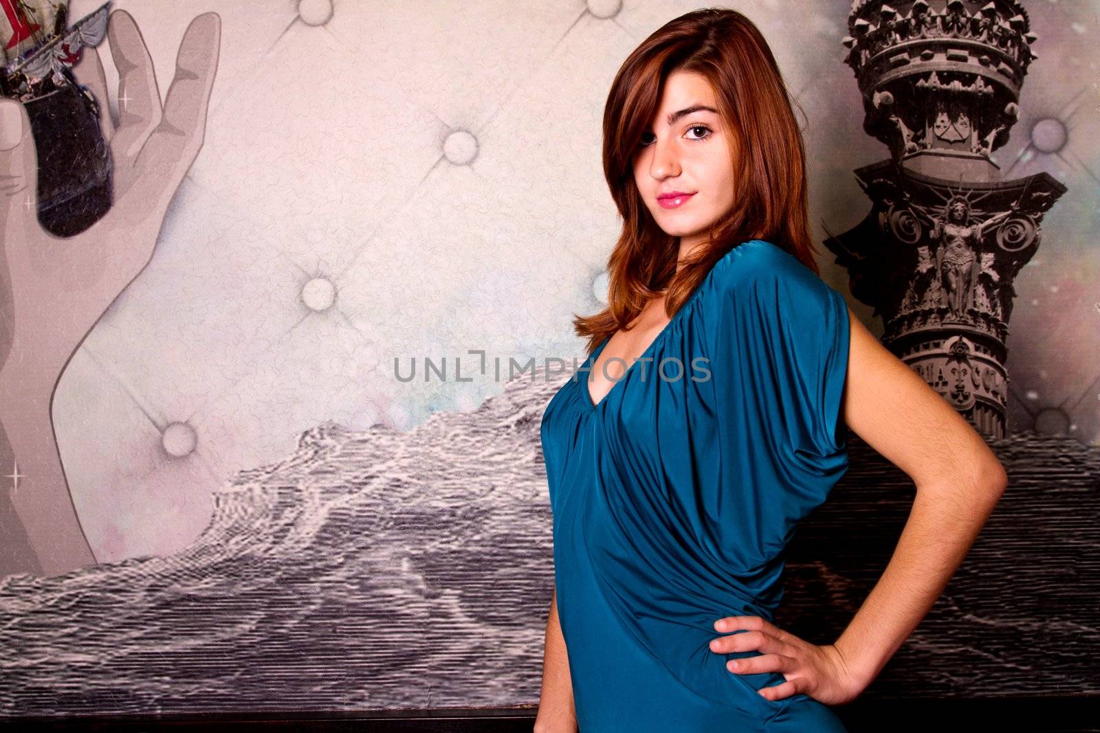 View of a beautiful young girl on a blue dress inside a bar pub.