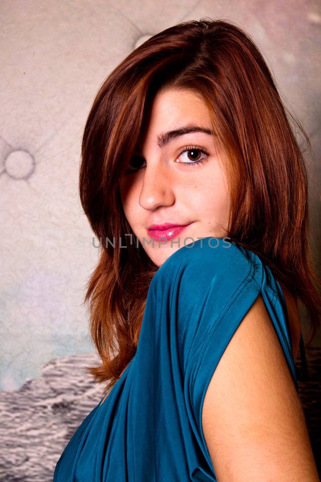 View of a beautiful young girl on a blue dress inside a bar pub.