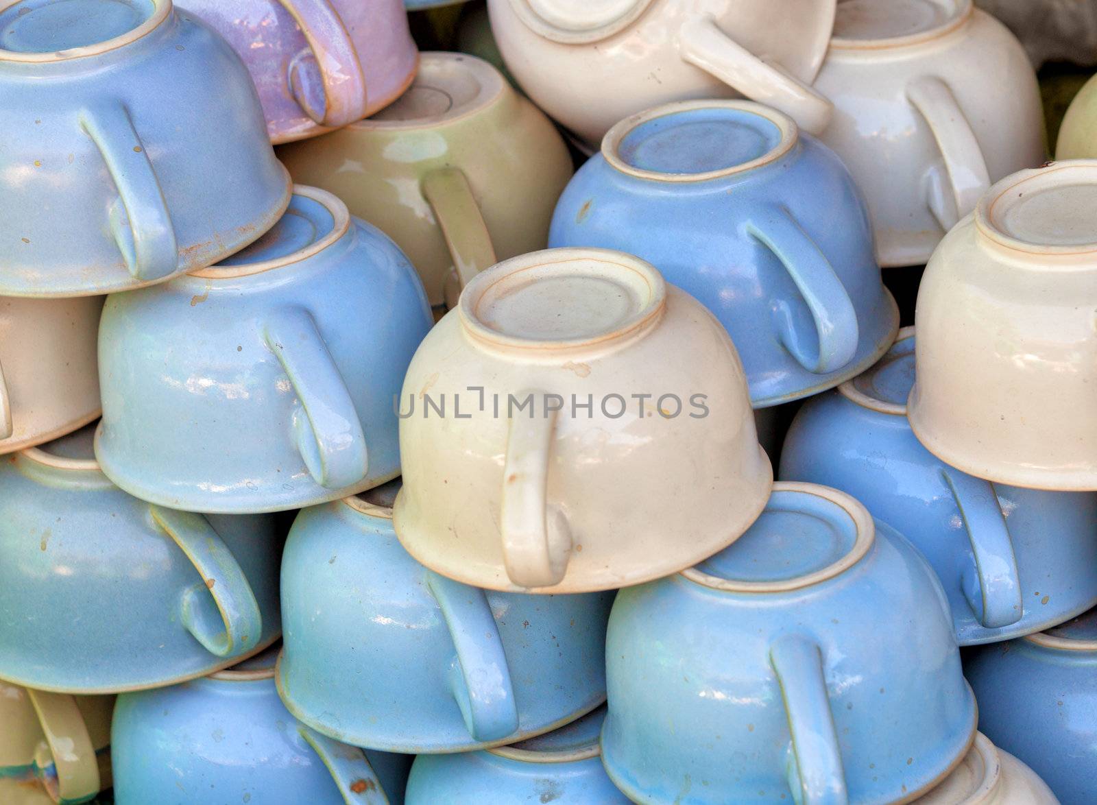 A large pile old-fashioned ceramic chamber pots on the market