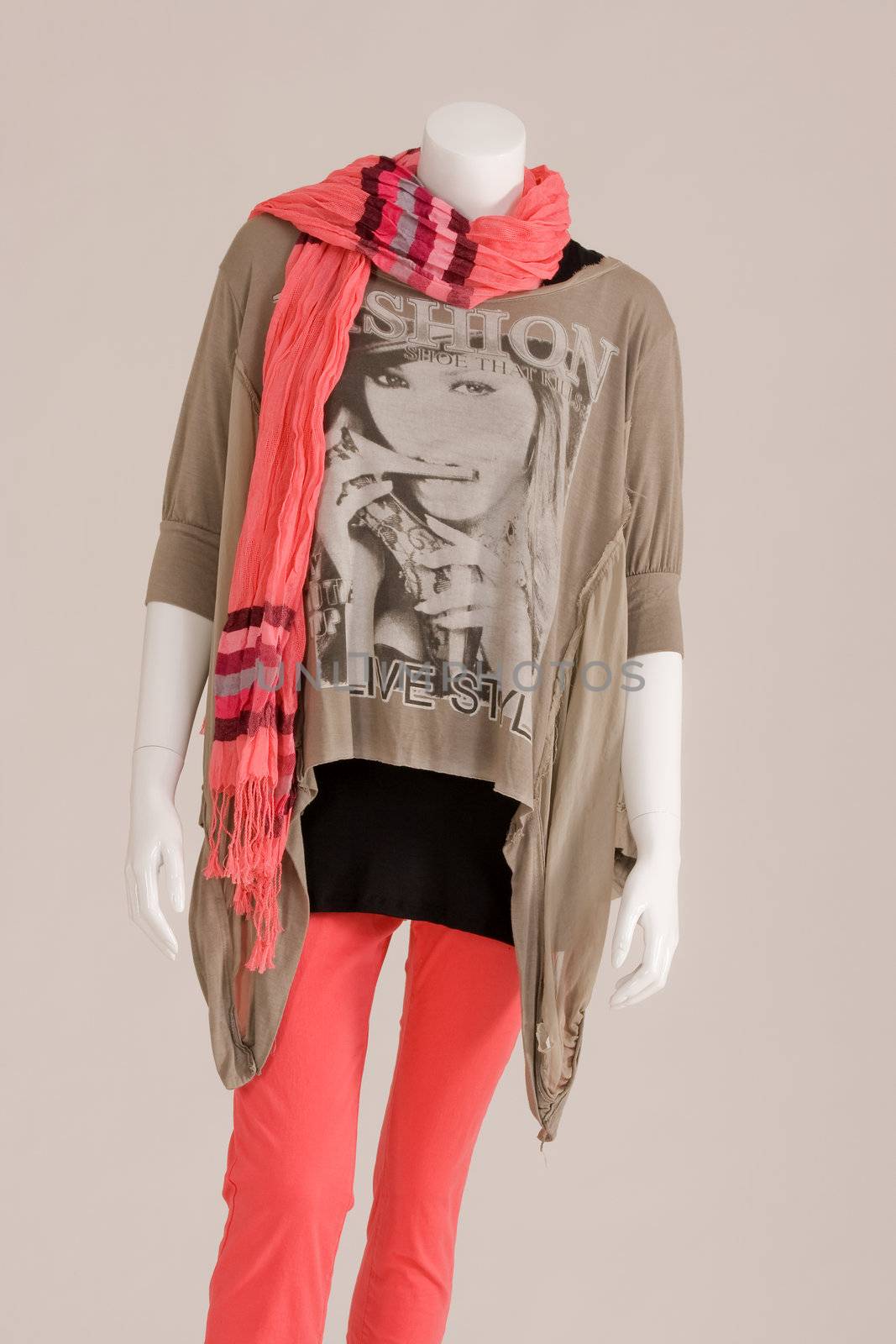 Mannequin dressed with a scarf, jacket, shirt and red pants