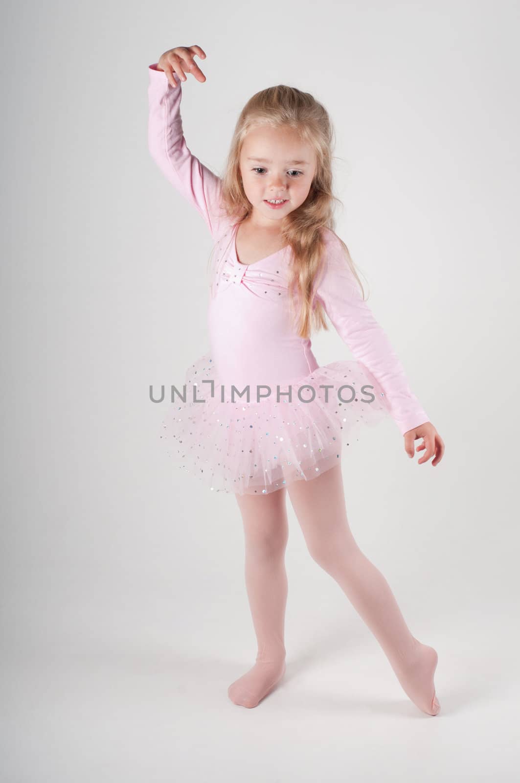 Studio shot of ballet dancer girl in pink