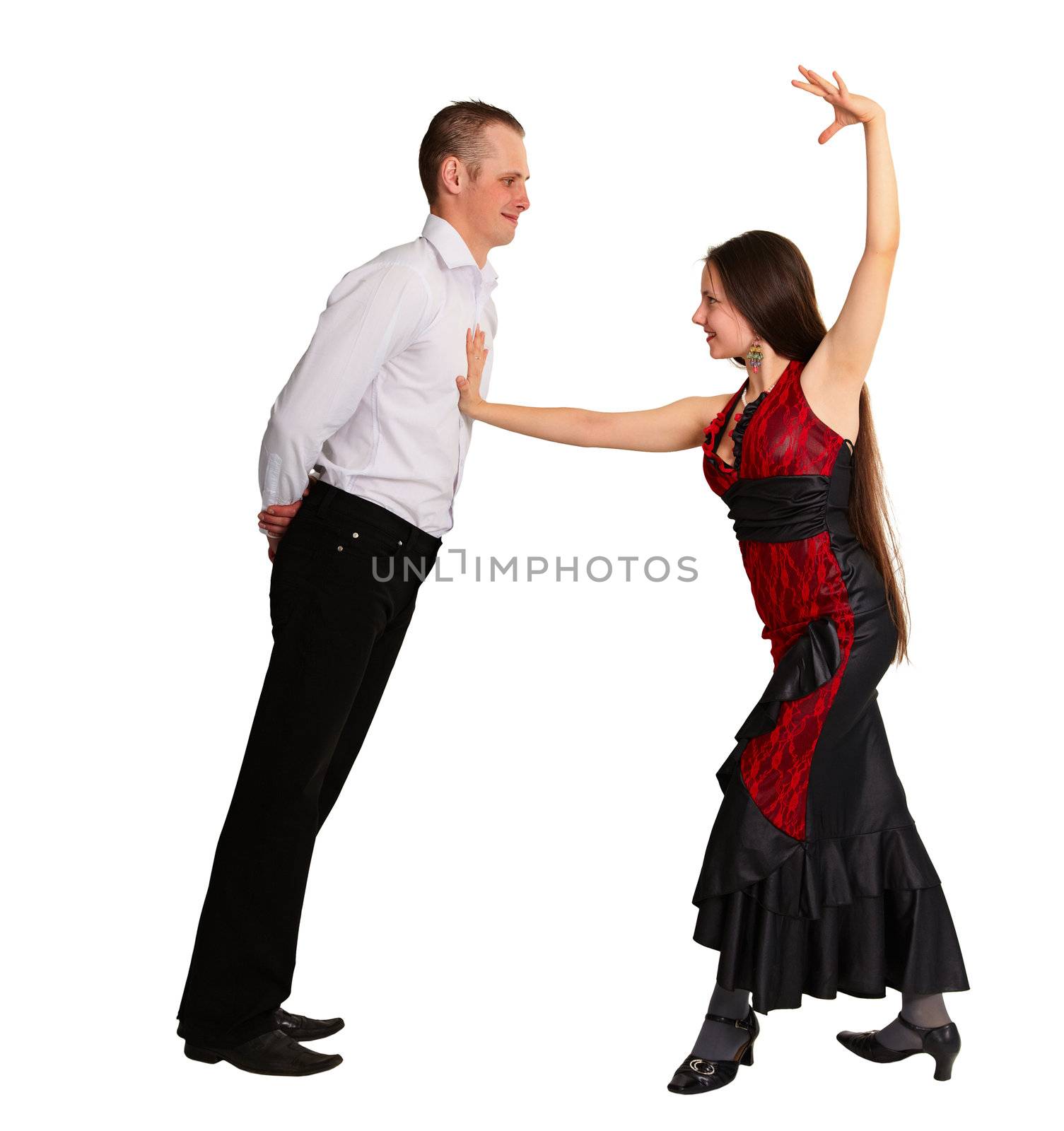 Boy and girl passionately dancing ballroom dance isolated on white background