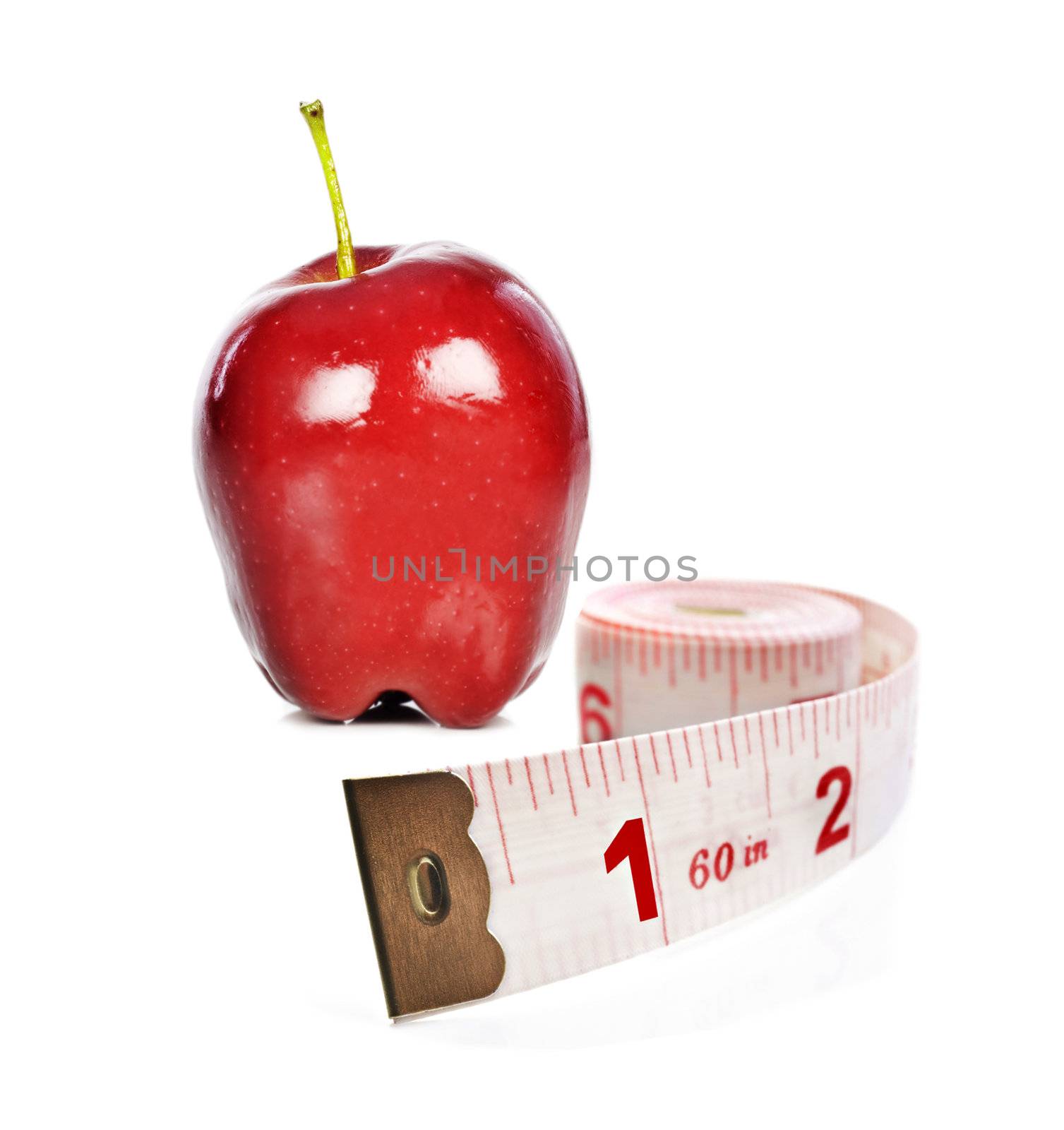 Healthy lifestyle - fresh healthy apple and tape measure on white