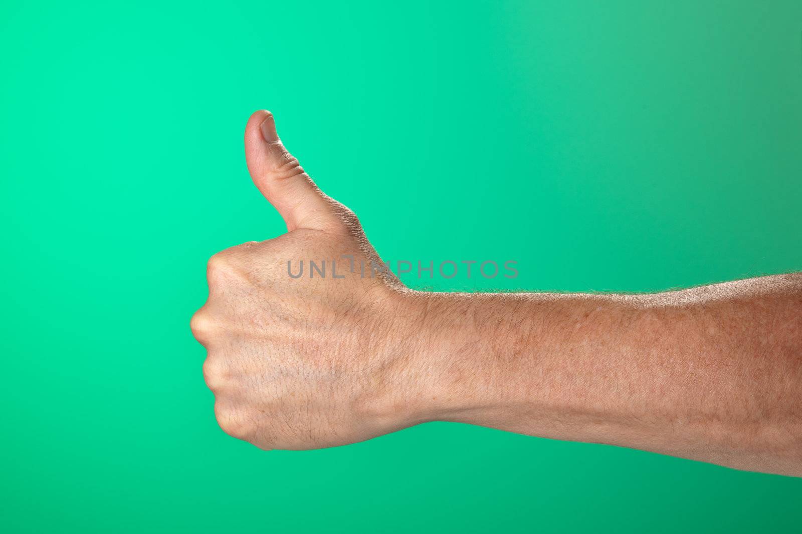 Thumbs Up OK Signal on Green Background