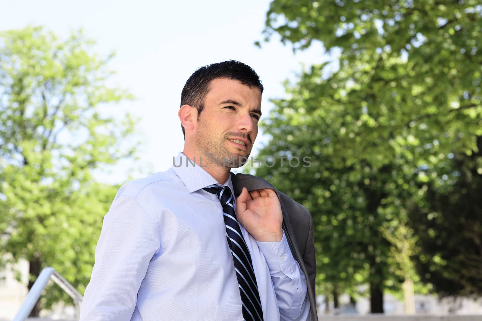 standing man waiting outdoor in a park