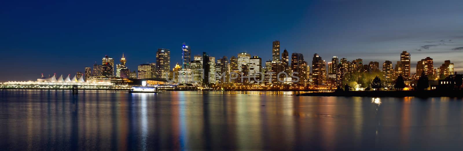 Vancouver BC Canada Skyline along False Creek from Stanley Park at Blue Hour Panorama