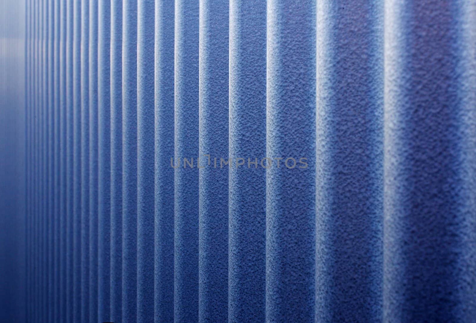 Vulcanized corrugated steel wall that looks like it diminished to infinity