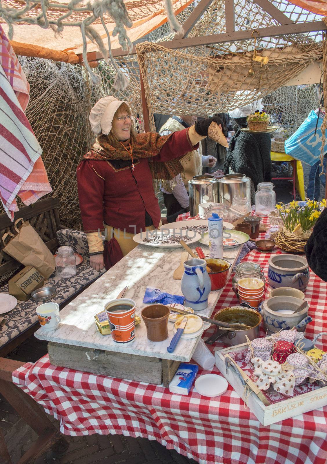 BRIELLE,HOLLAND APRIL 01:Woman selling candy on April 01, 2013 in Brielle,Holland.This is the party of the point in the uprising of Low Countries against Spain in the 80 Years' War