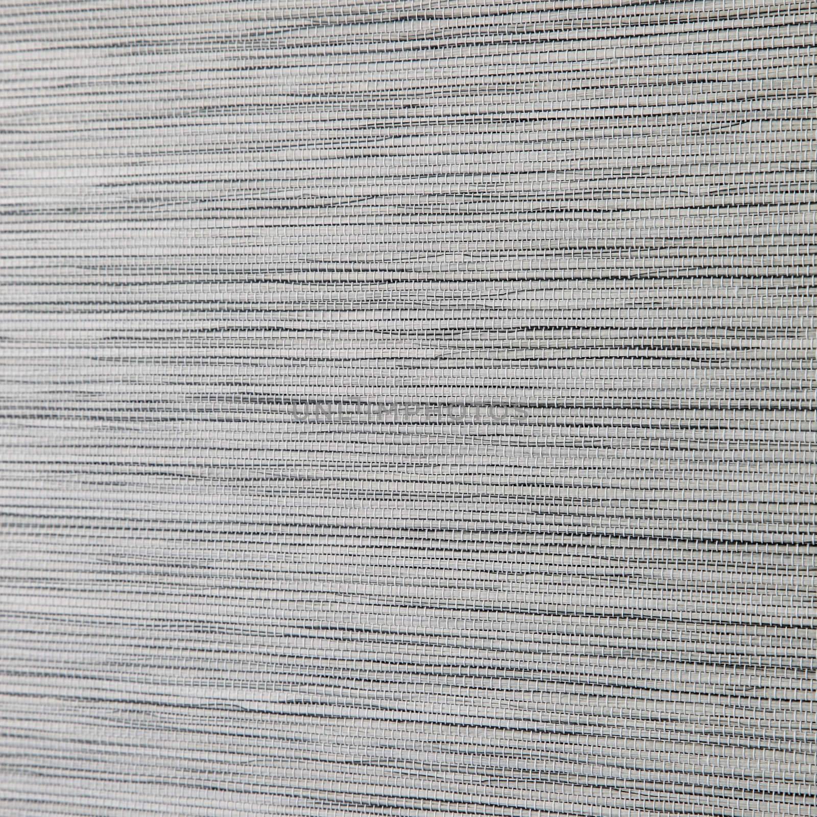 Close-up image of a fabric with grey colored texture.