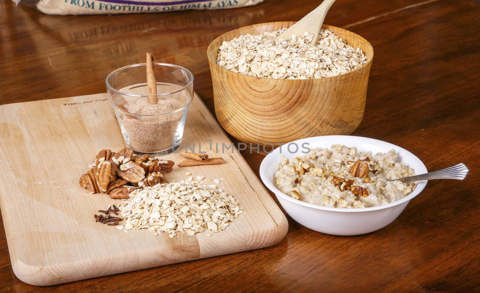 Ingredients on a table to prepare a hot bowl of oatmeal