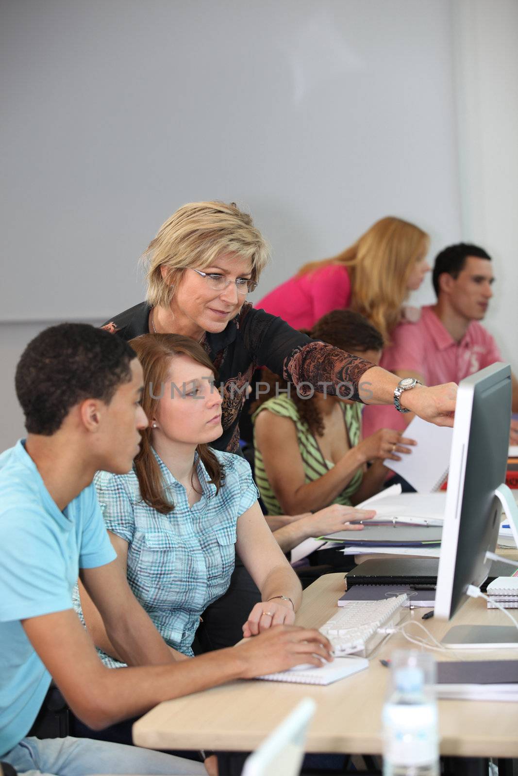 Students in classroom by phovoir