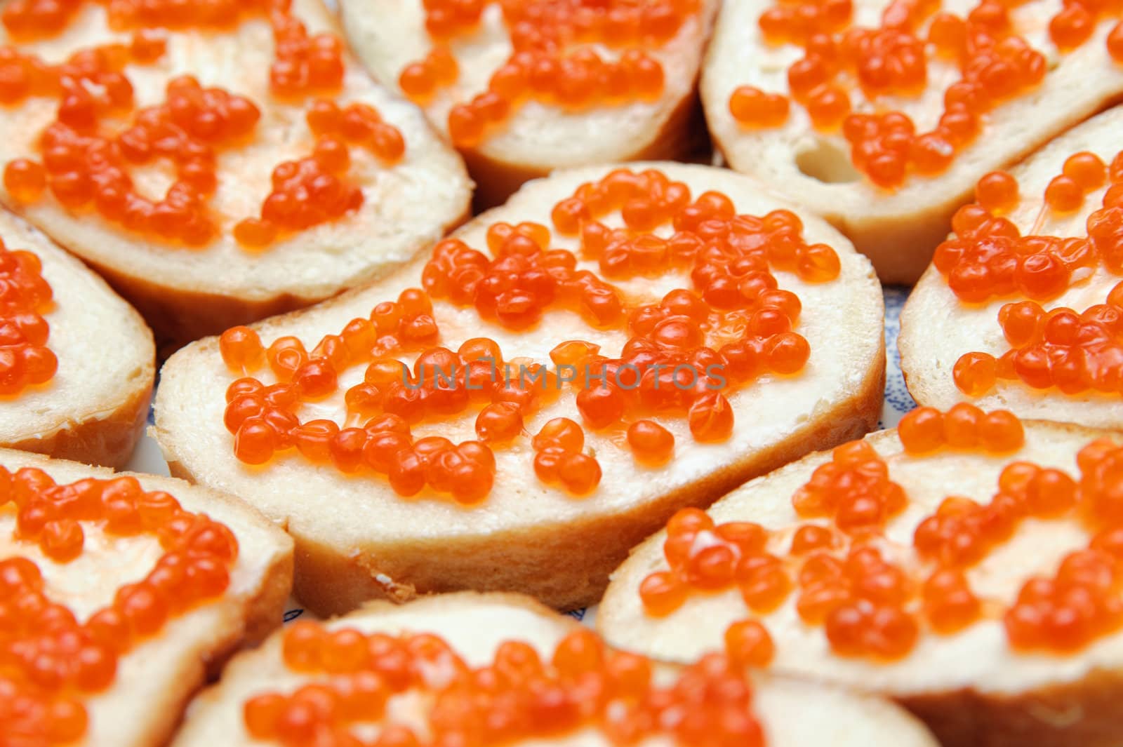 bread and butter with red caviar. Gourmet food