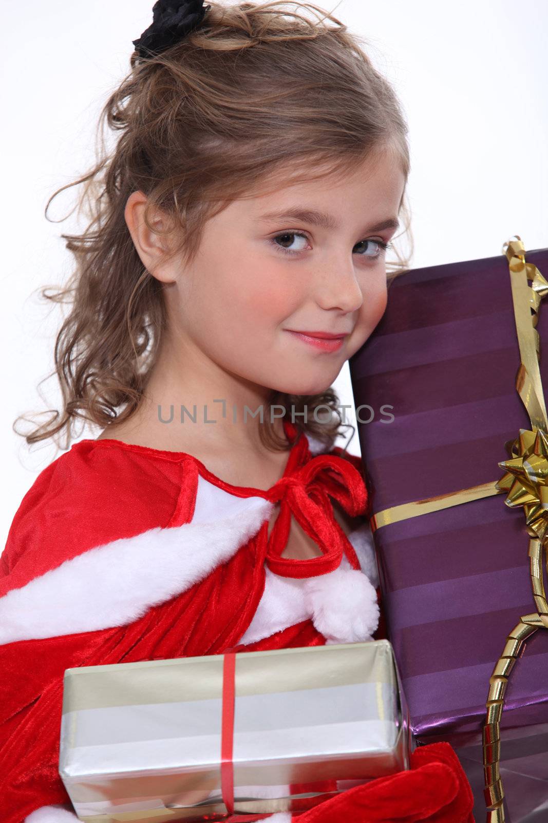 Pretty girl holding her Christmas presents by phovoir