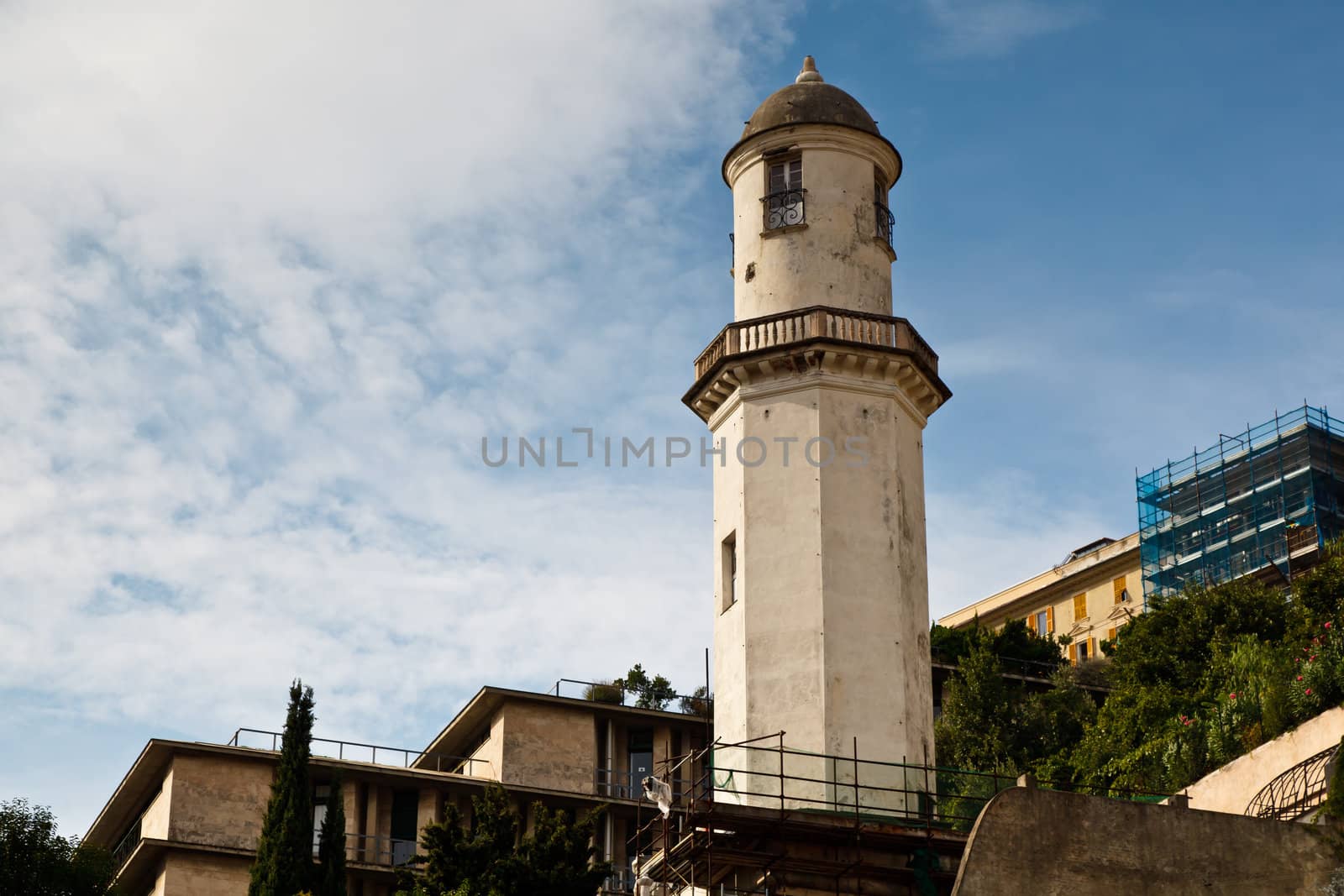 Old White Lighthouse on the Sea Coast in Genoa, Italy