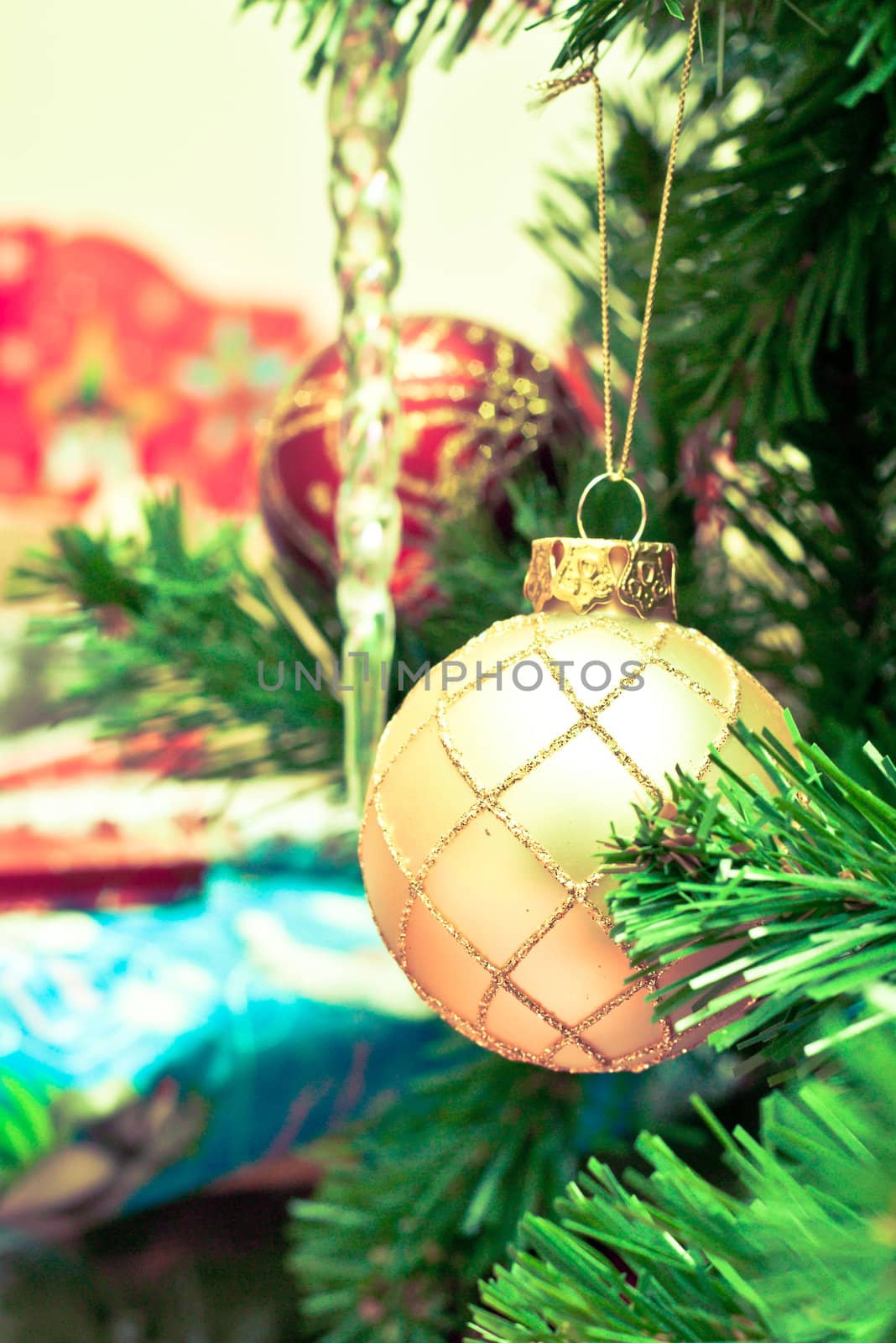 Close up of christmas tree decorations and wrapped presents