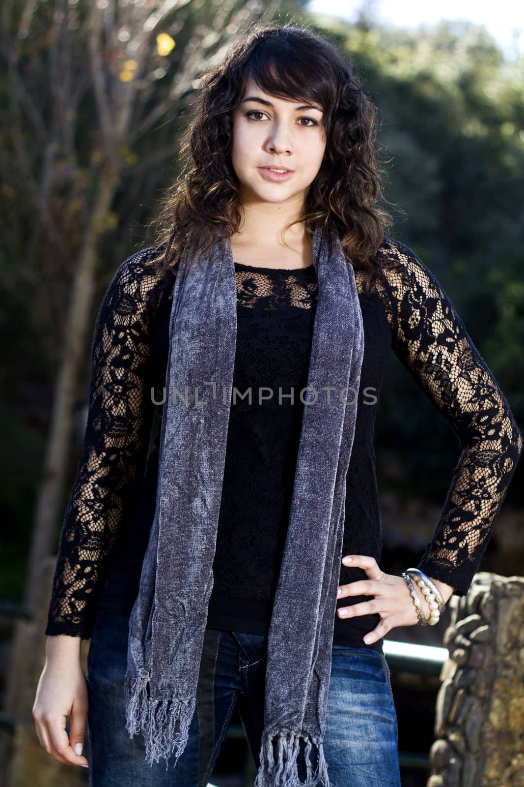 View of a beautiful girl on a urban park on a autumn set.