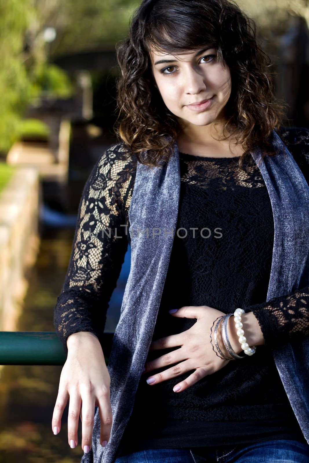 View of a beautiful girl on a urban park on a autumn set.