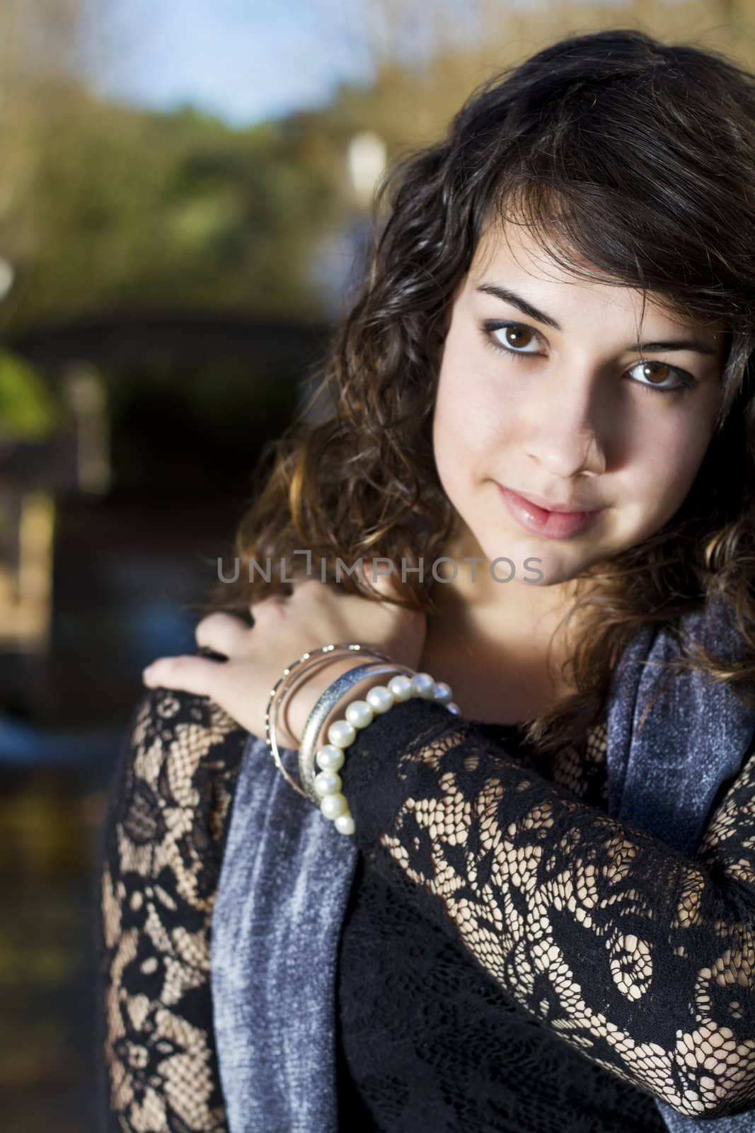 View of a beautiful girl on a urban park on a autumn set.