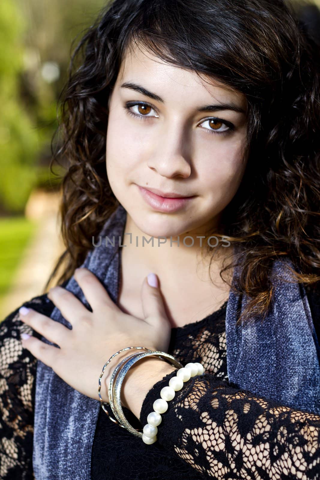 View of a beautiful girl on a urban park on a autumn set.