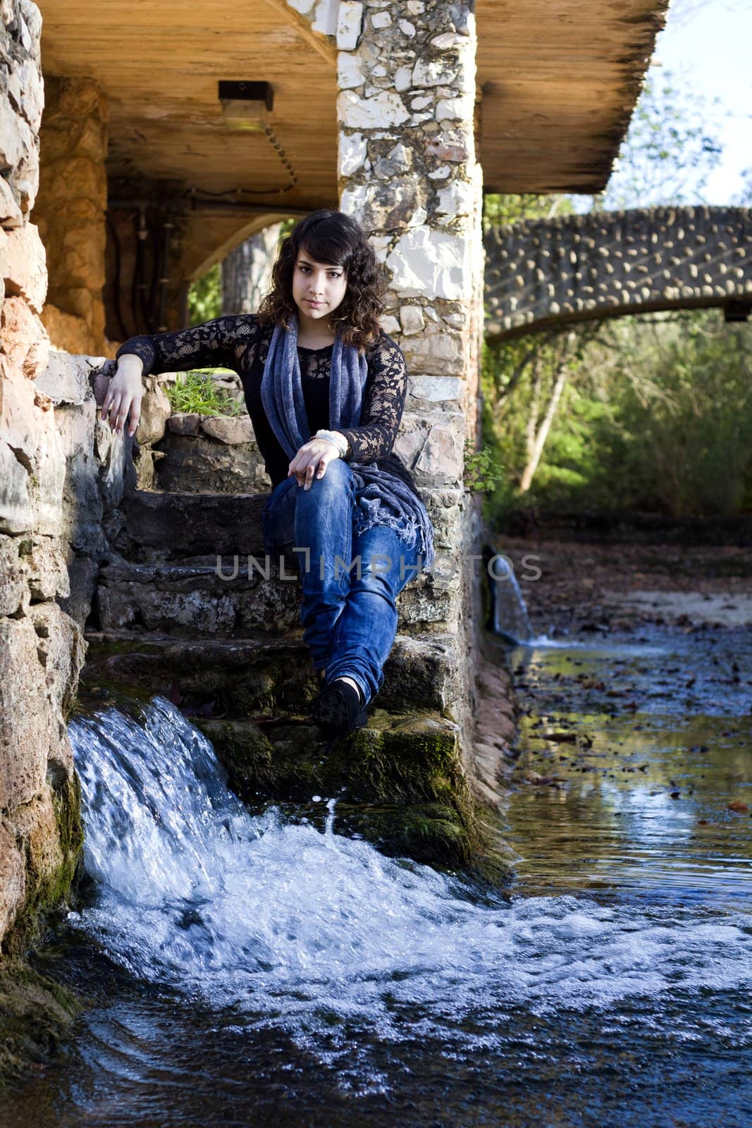 View of a beautiful girl on a urban park on a autumn set.