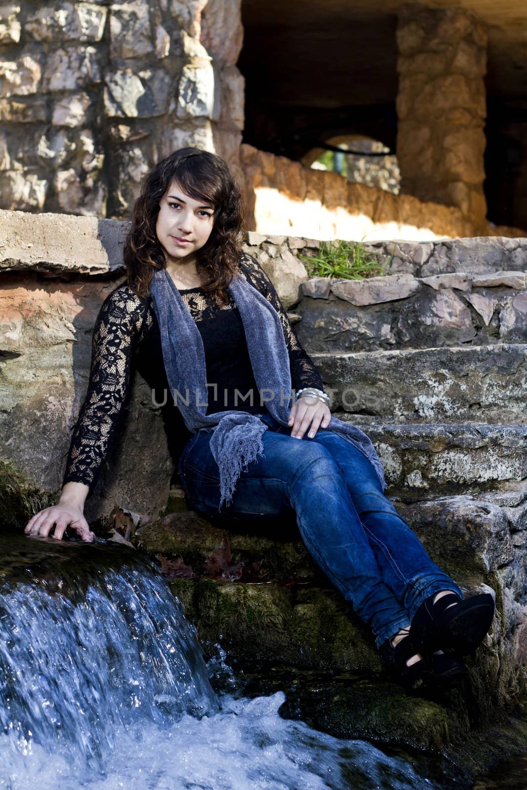 View of a beautiful girl on a urban park on a autumn set.