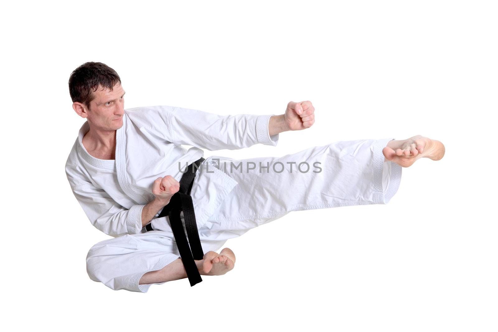 Karate jump against white background 
