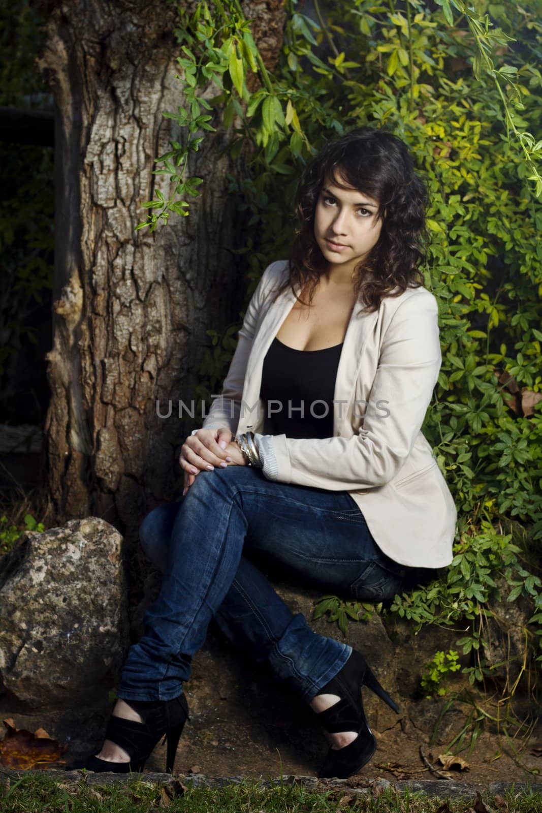 View of a beautiful girl on a urban park on a autumn set.