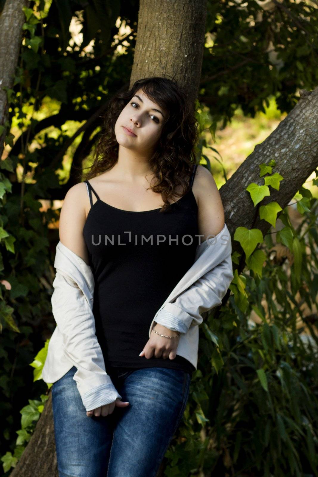 View of a beautiful girl on a urban park on a autumn set.