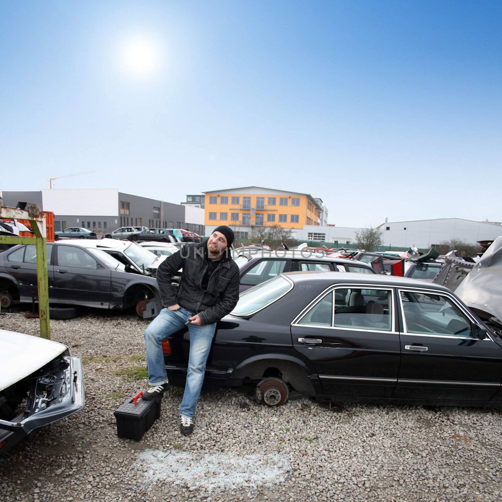 man looking for car parts by photochecker