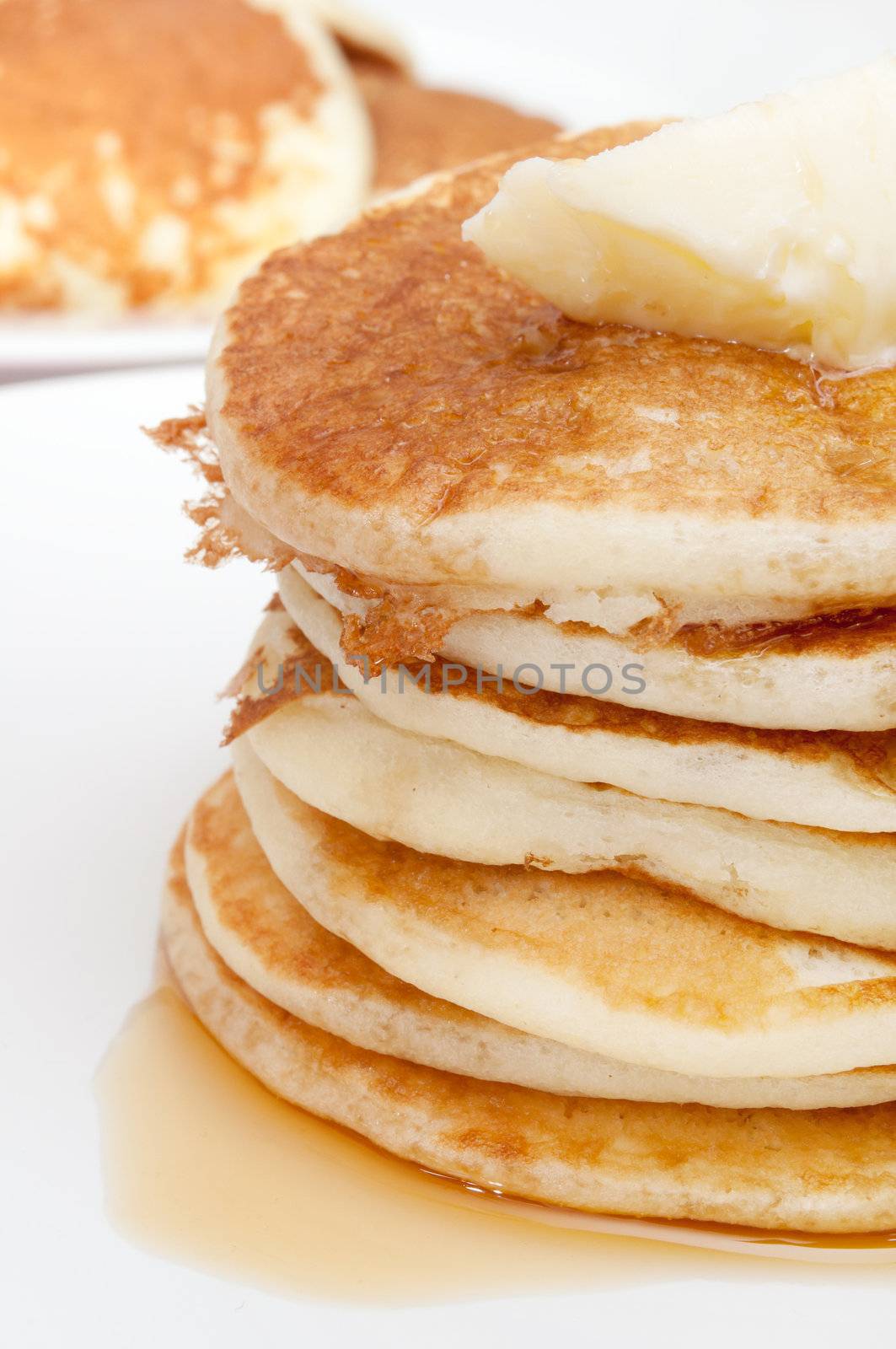 Homemade Pancakes With Butter and Warm Maple Syrup 