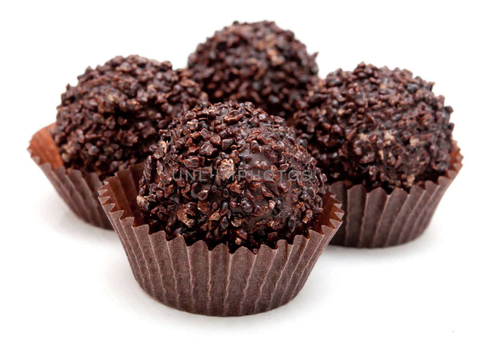 Delicious Chocolate Filled Pralines on White Background
