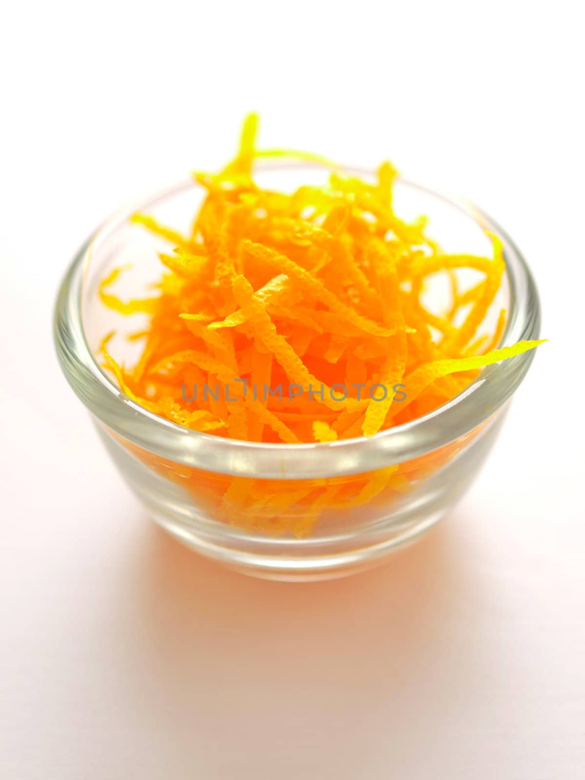 close up of a bowl of orange zest