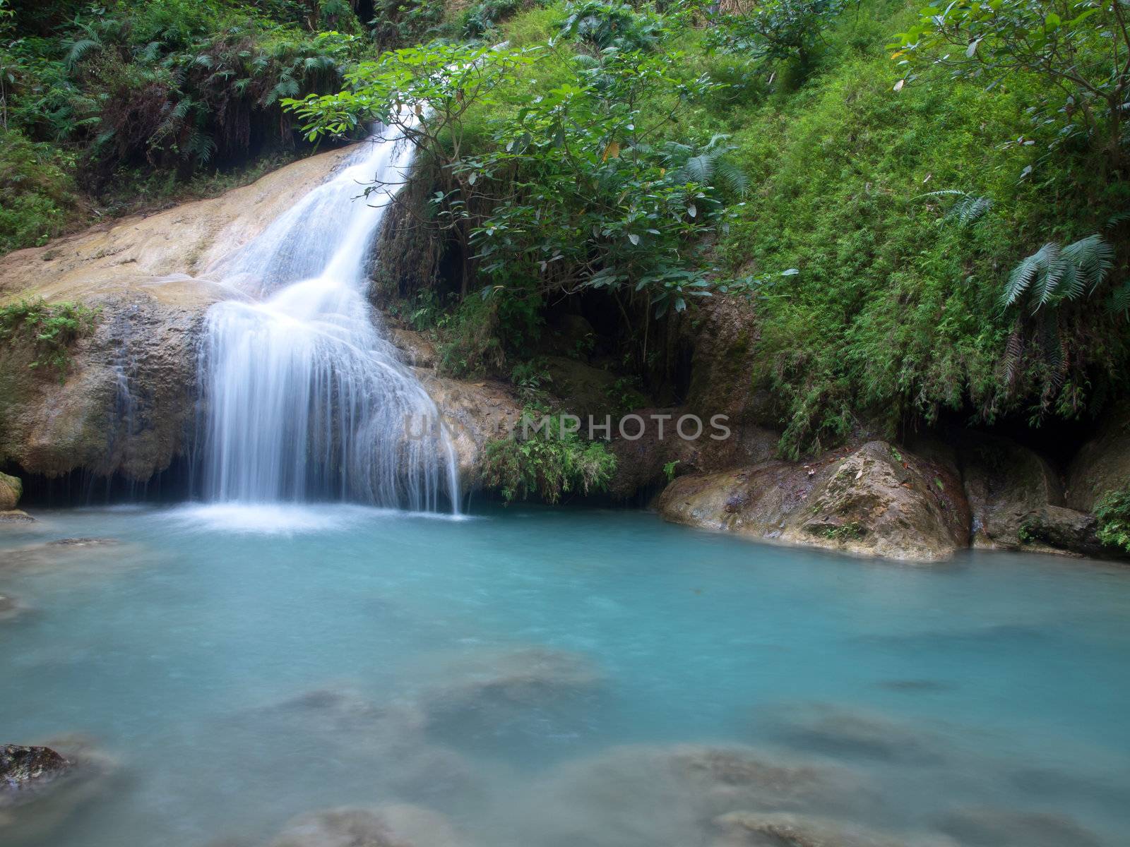 Emerald color water in tier seventh of Erawan waterfall, Erawan National Park, Kanchanaburi, Thailand