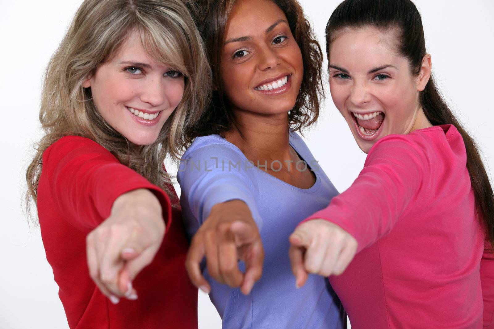 A group of young women pointing their fingers by phovoir